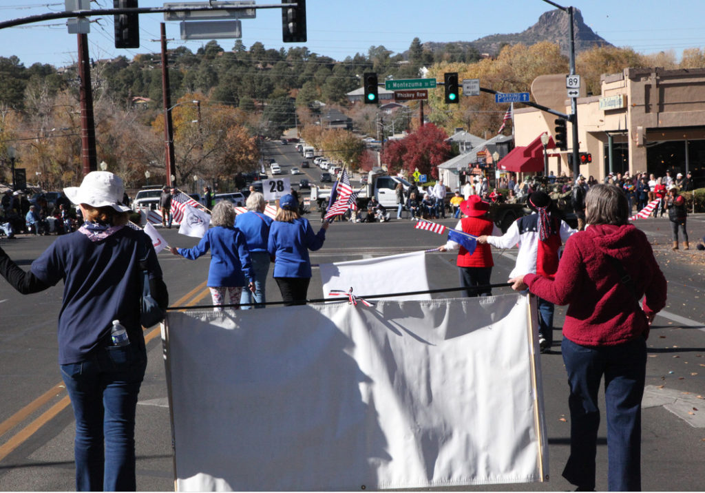 This is a photo of members of General George Crook Chapter, NSDAR, marching in the Prescott Veterans Day Parade.