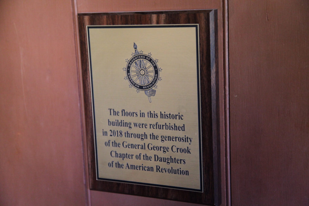This photo shows a plaque at the Sharlot Hall Museum commemorating restoration work sponsored through the General George Crook Chapter, NSDAR.